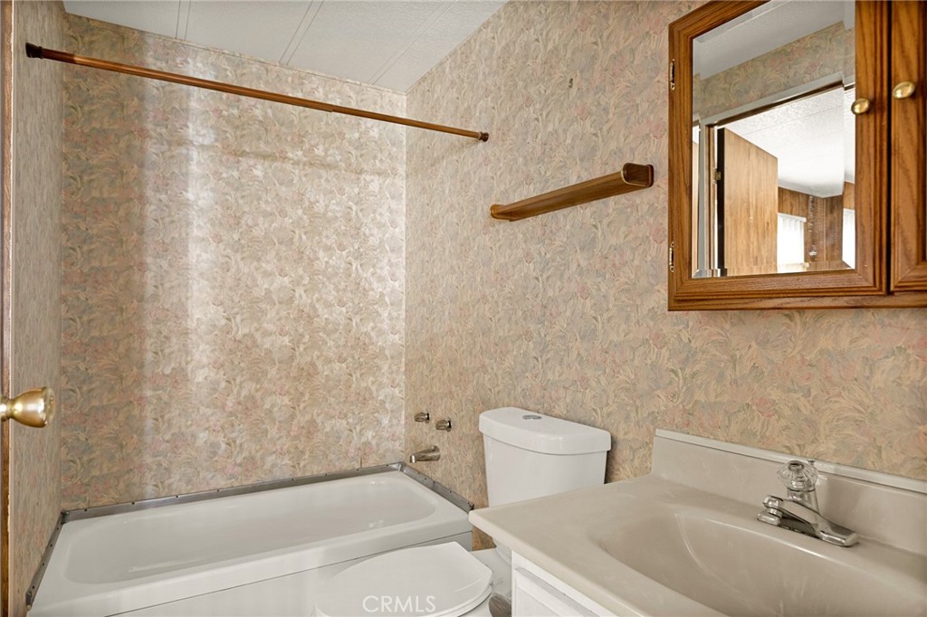 12367 4th Street Yucaipa, CA 92399 - Photo 16 of 19 a bathroom with a sink and a bathtub
