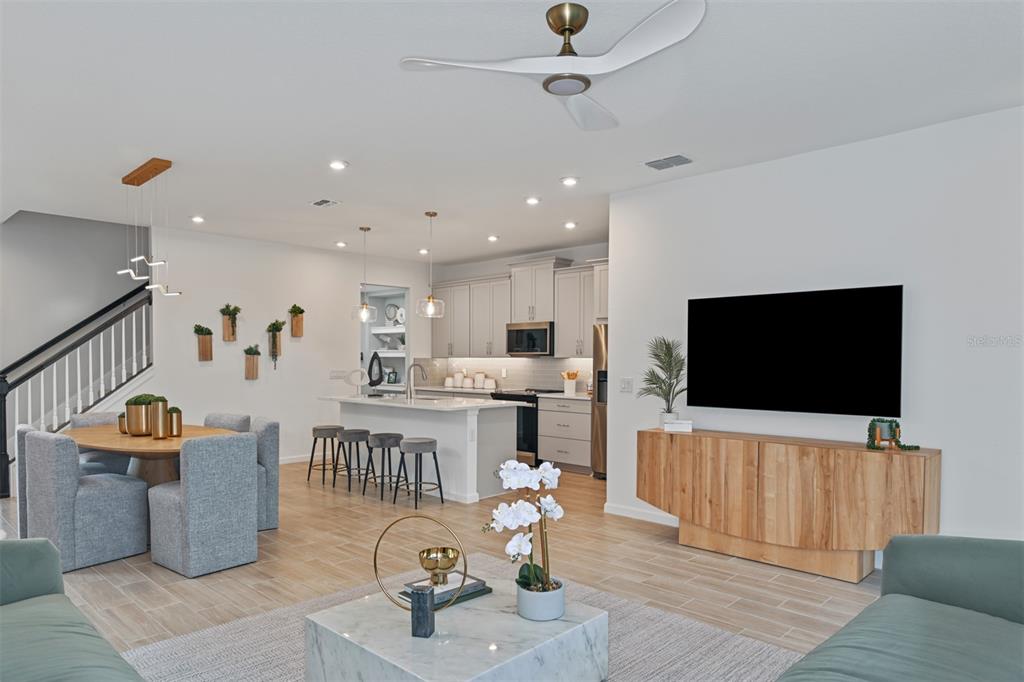3358 Timber Xing Avenue Brandon, FL 33511 - Photo 11 of 22 a living room with furniture and a flat screen tv