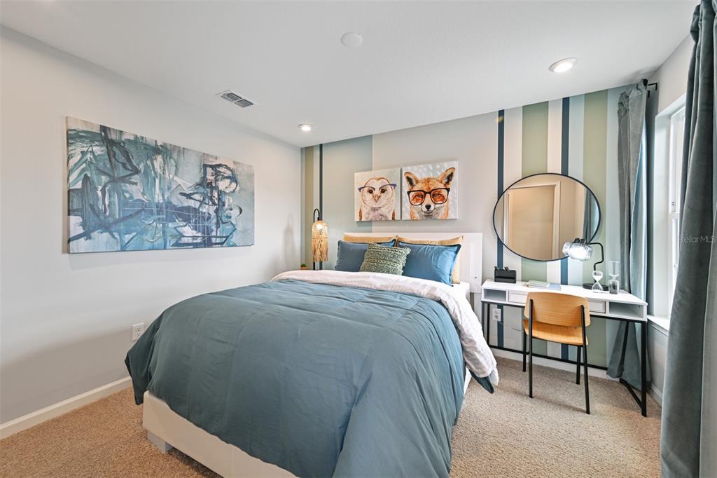 3358 Timber Xing Avenue Brandon, FL 33511 - Photo 18 of 22 a bed room with a bed and painting on the wall