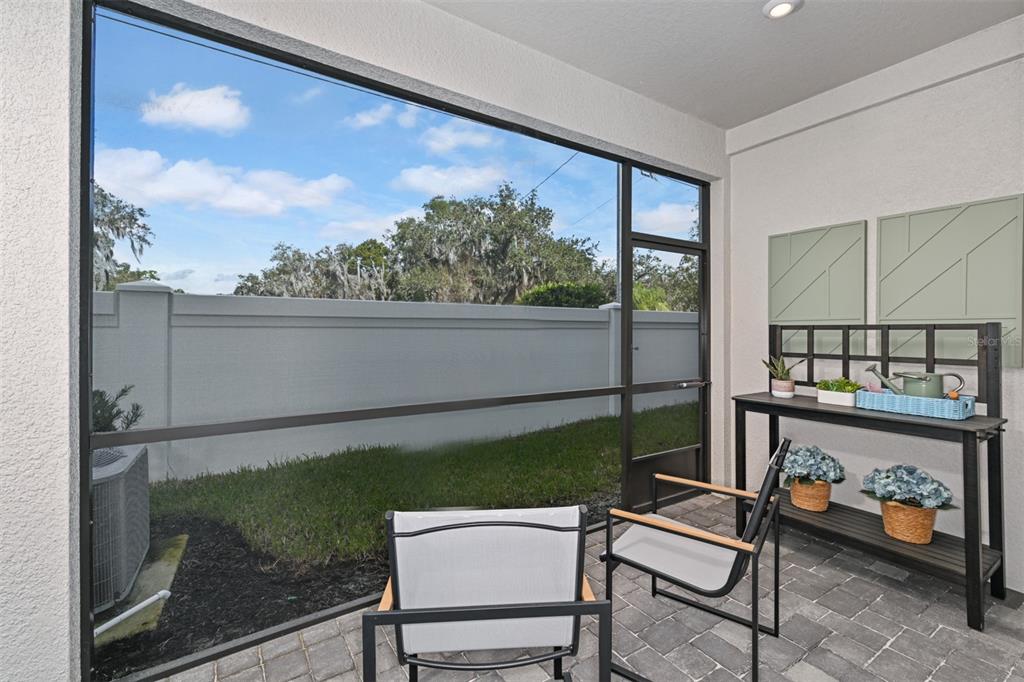 3358 Timber Xing Avenue Brandon, FL 33511 - Photo 21 of 22 a view of a porch with furniture and garden