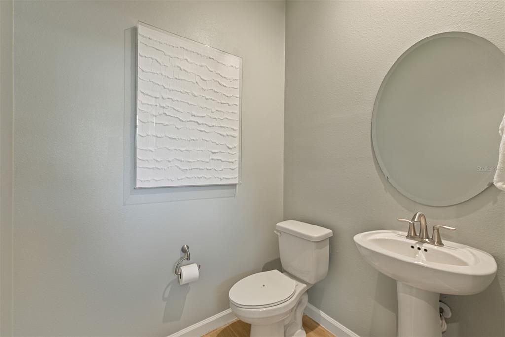 3358 Timber Xing Avenue Brandon, FL 33511 - Photo 9 of 22 a bathroom with a toilet sink and mirror
