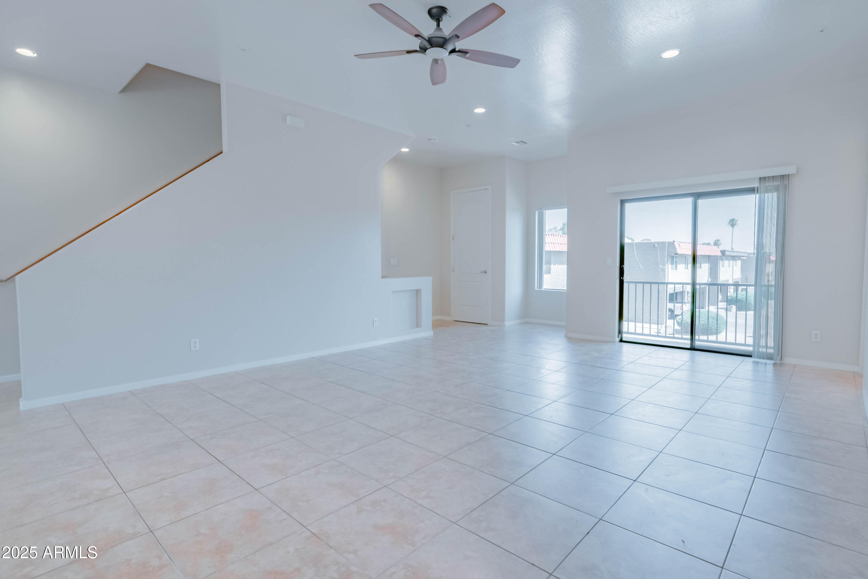4739 East Culver Street Phoenix, AZ 85008 - Photo 12 of 55 an empty room with chandelier and windows