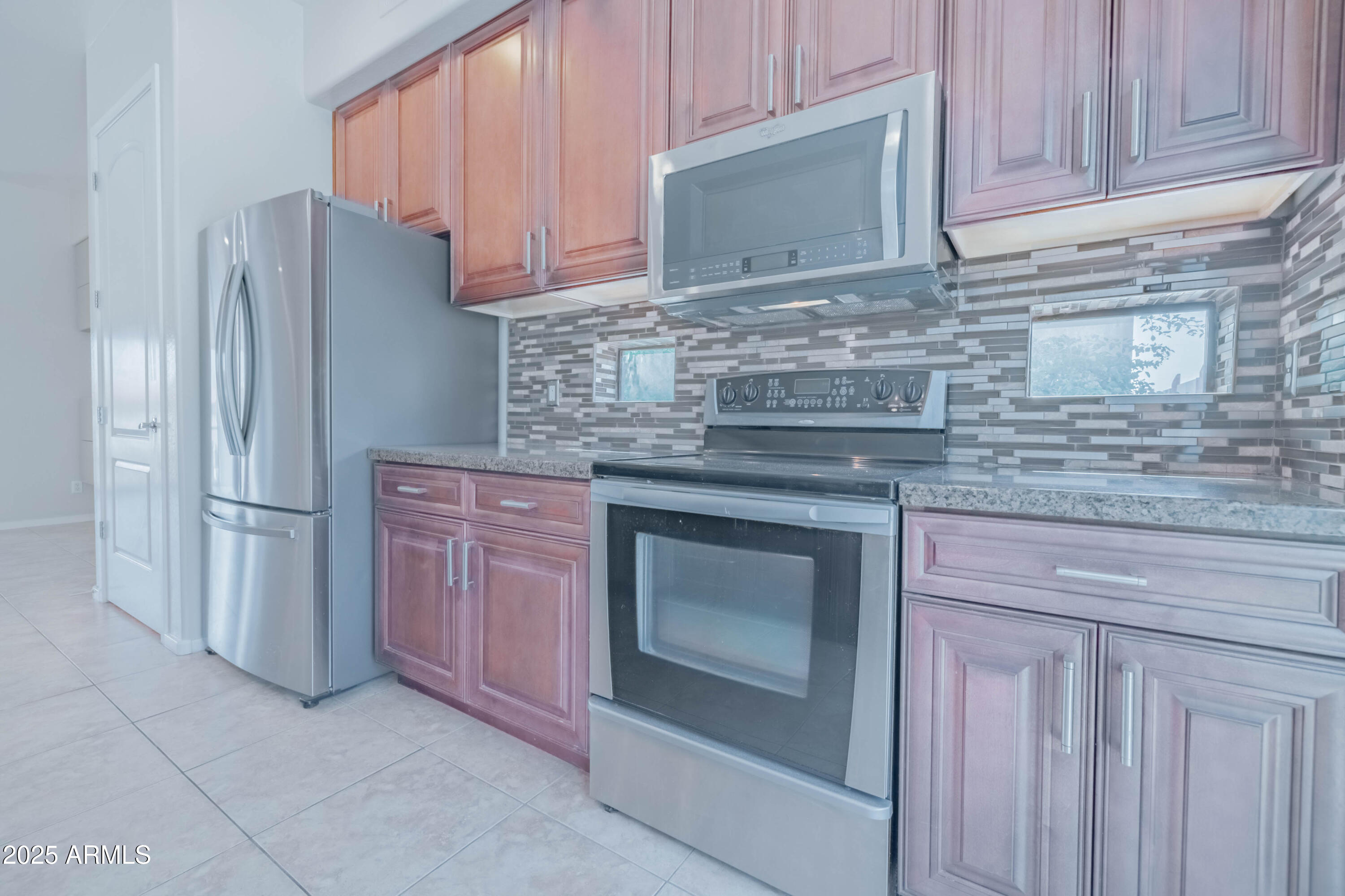 4739 East Culver Street Phoenix, AZ 85008 - Photo 15 of 55 a kitchen with granite countertop cabinets and steel stainless steel appliances
