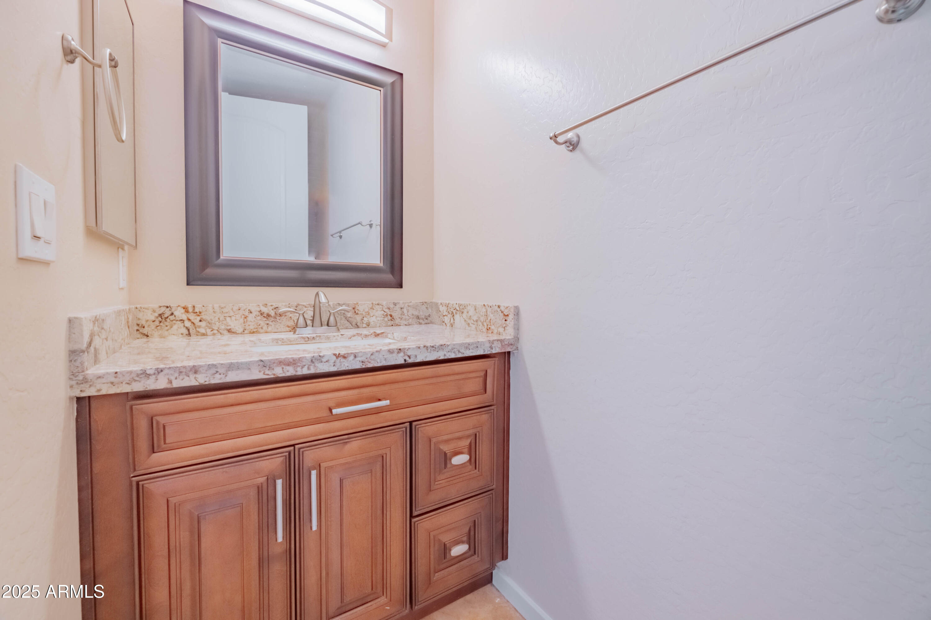4739 East Culver Street Phoenix, AZ 85008 - Photo 18 of 55 a bathroom with a granite countertop sink and a mirror