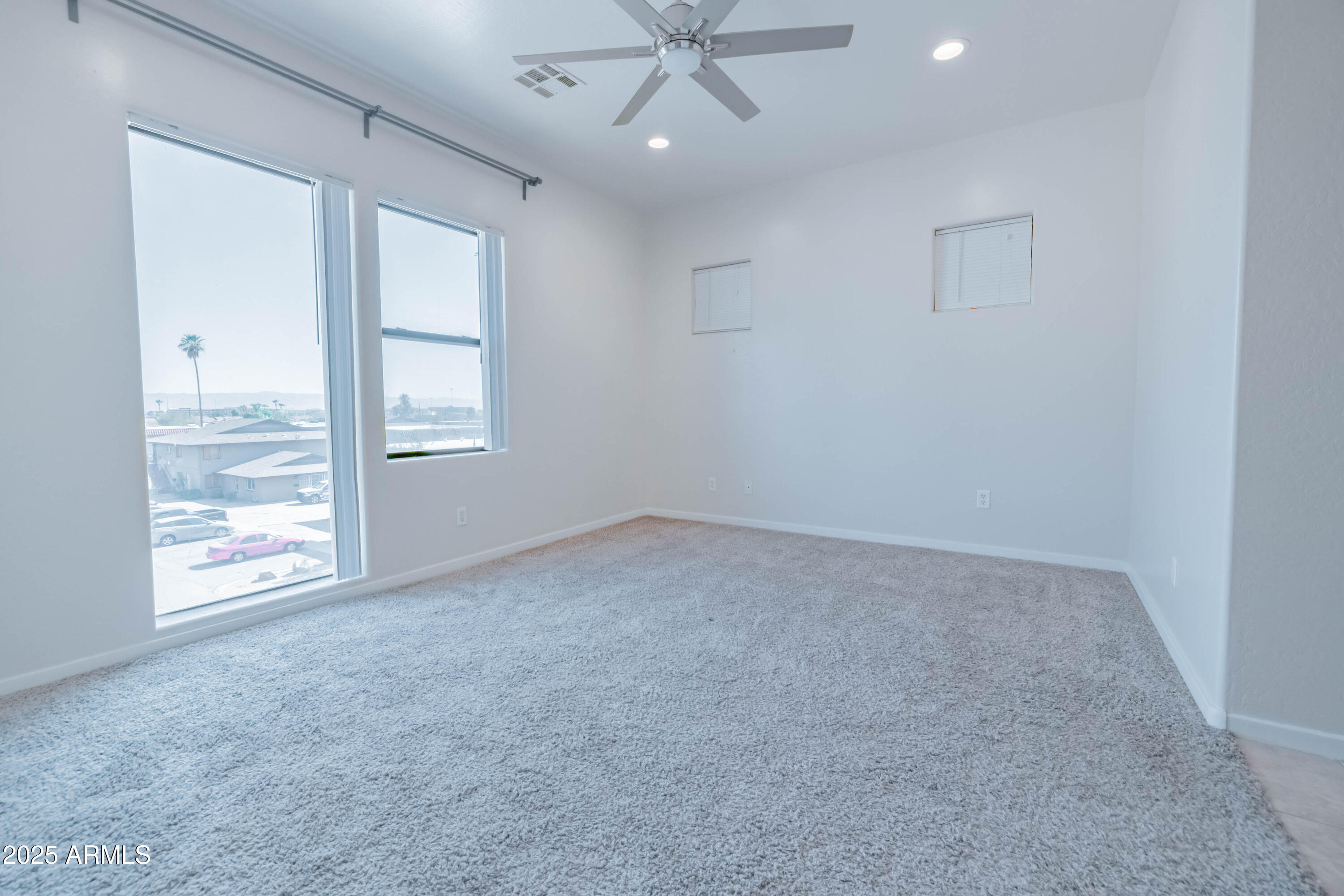 4739 East Culver Street Phoenix, AZ 85008 - Photo 21 of 55 an empty room with windows and closet