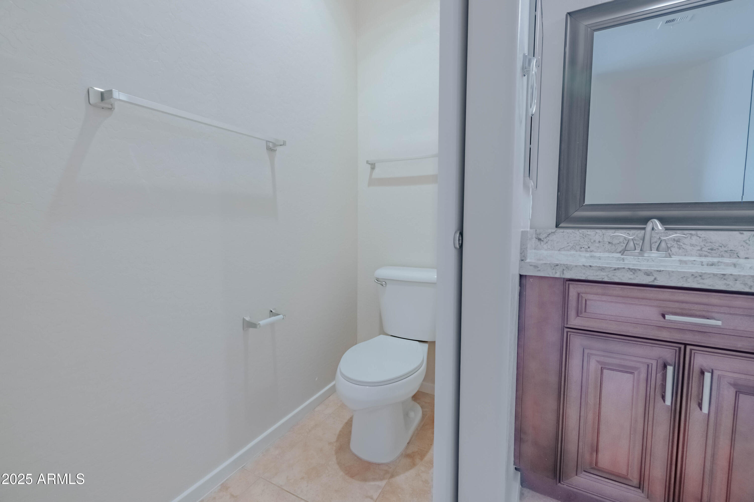 4739 East Culver Street Phoenix, AZ 85008 - Photo 26 of 55 a bathroom with a granite countertop sink and a toilet