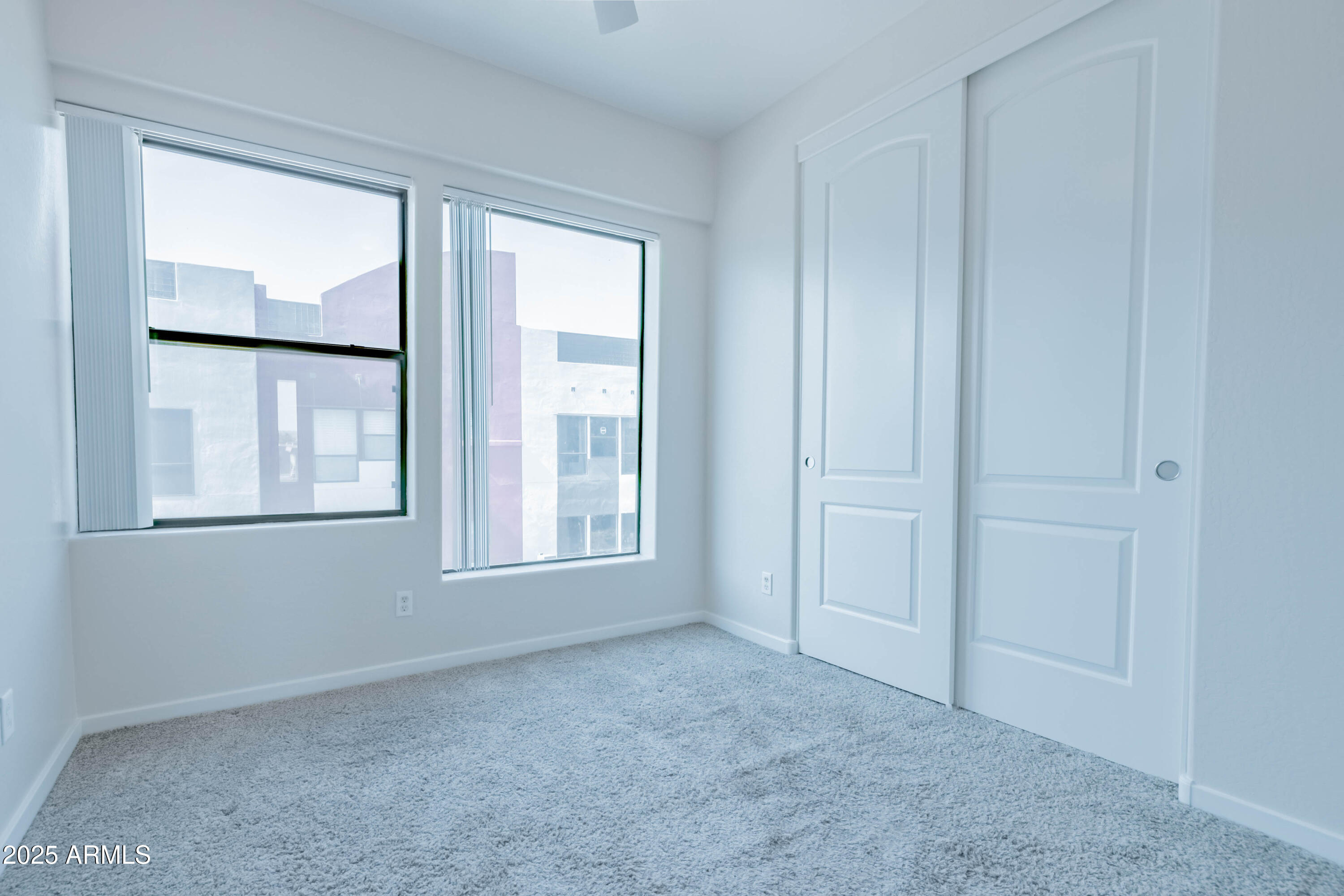 4739 East Culver Street Phoenix, AZ 85008 - Photo 27 of 55 an empty room with windows and closet