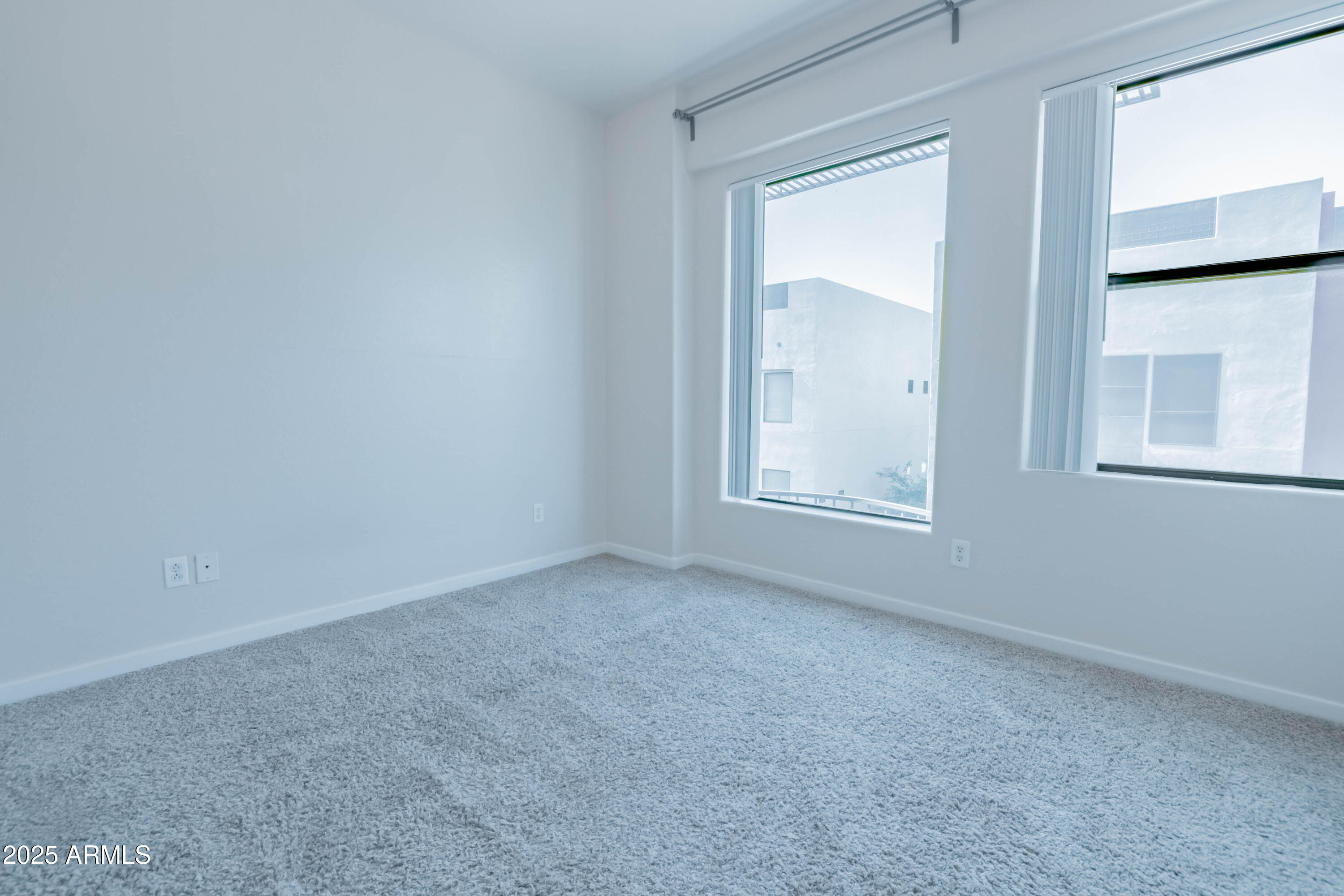 4739 East Culver Street Phoenix, AZ 85008 - Photo 31 of 55 an empty room with windows and closet