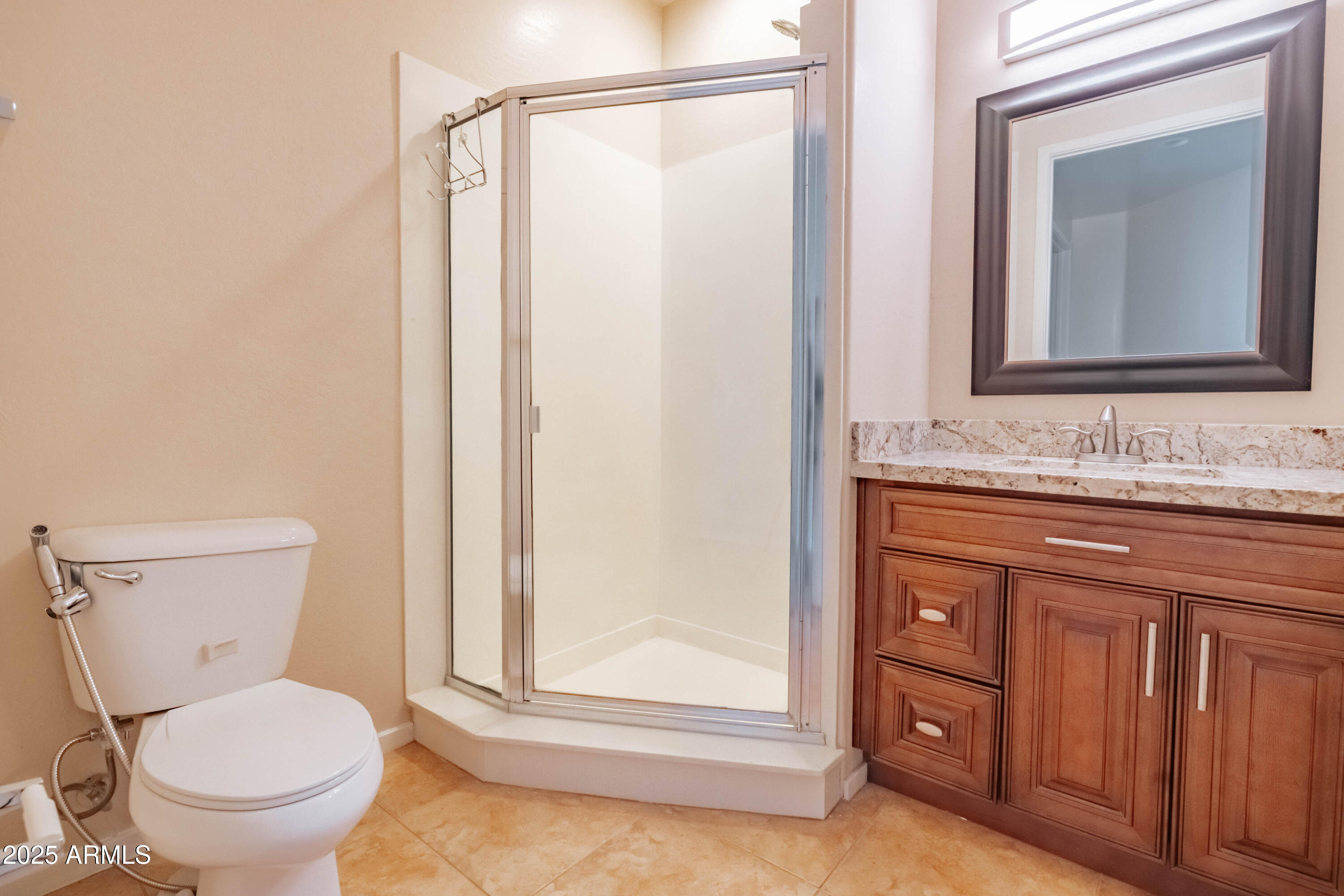 4739 East Culver Street Phoenix, AZ 85008 - Photo 35 of 55 a bathroom with a granite countertop toilet sink and mirror