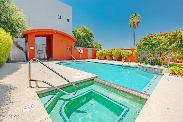 a city street lined with tall buildings and trees