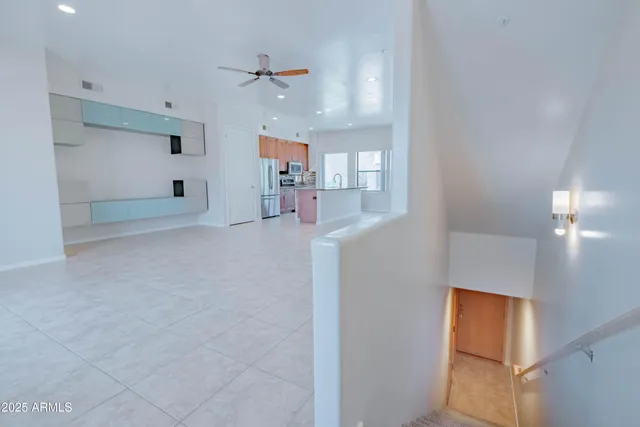 a kitchen with stainless steel appliances a refrigerator and a stove top oven