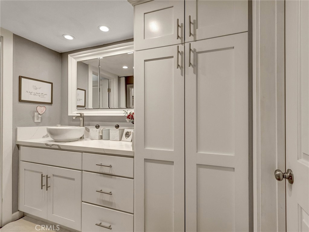 1200 West Lambert Road, Unit 44 La Habra, CA 90631 - Photo 11 of 33 a bathroom with a granite countertop sink mirror and double