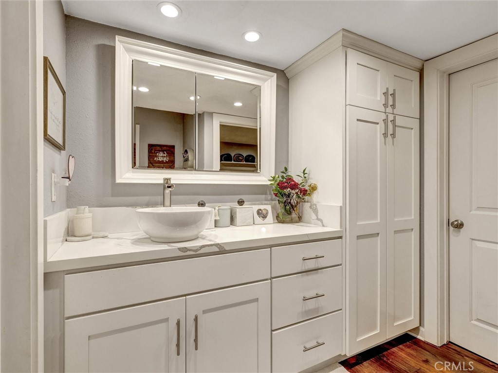 1200 West Lambert Road, Unit 44 La Habra, CA 90631 - Photo 12 of 33 a bathroom with a sink vanity granite and a mirror