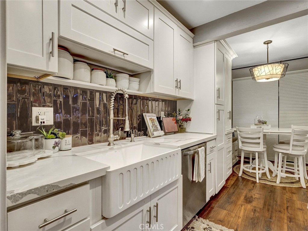 1200 West Lambert Road, Unit 44 La Habra, CA 90631 - Photo 18 of 33 a kitchen with a sink and chairs