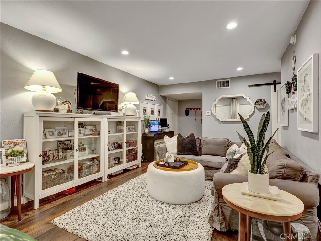 1200 West Lambert Road, Unit 44 La Habra, CA 90631 - Photo 26 of 33 a living room with furniture and a flat screen tv
