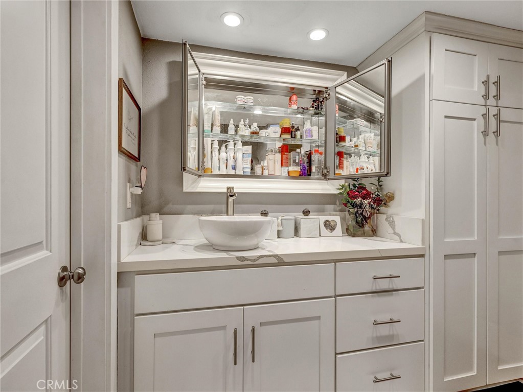 1200 West Lambert Road, Unit 44 La Habra, CA 90631 - Photo 4 of 33 a bathroom with a sink vanity and mirror