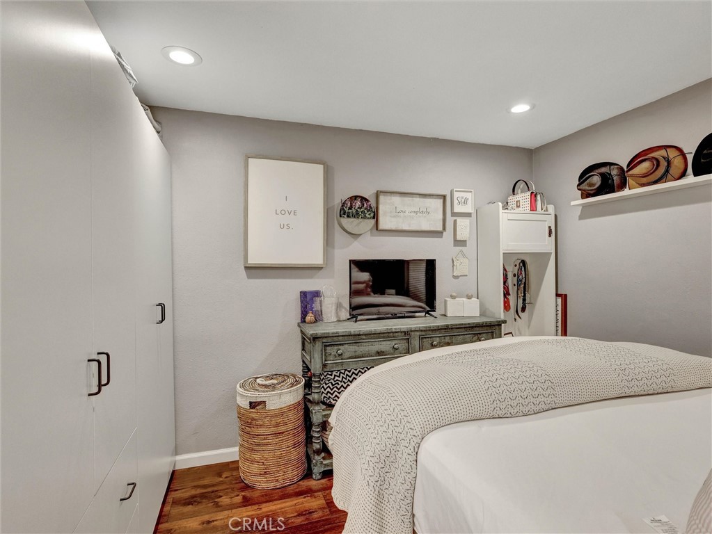 1200 West Lambert Road, Unit 44 La Habra, CA 90631 - Photo 6 of 33 a bedroom with a bed and a flat screen tv
