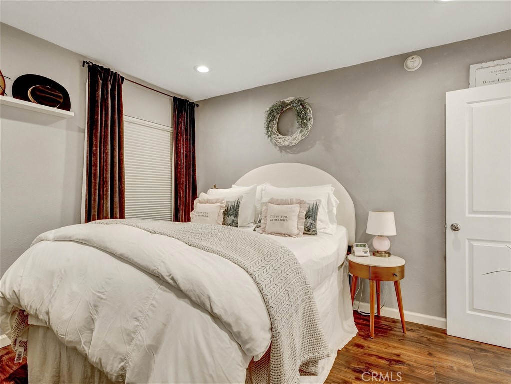 1200 West Lambert Road, Unit 44 La Habra, CA 90631 - Photo 9 of 33 a bedroom with a bed and a chandelier