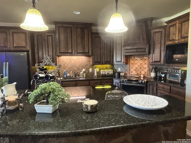 a view of living room with furniture and a painting on the wall