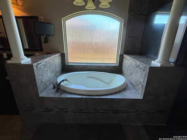 a bathroom with a sink vanity and toilet