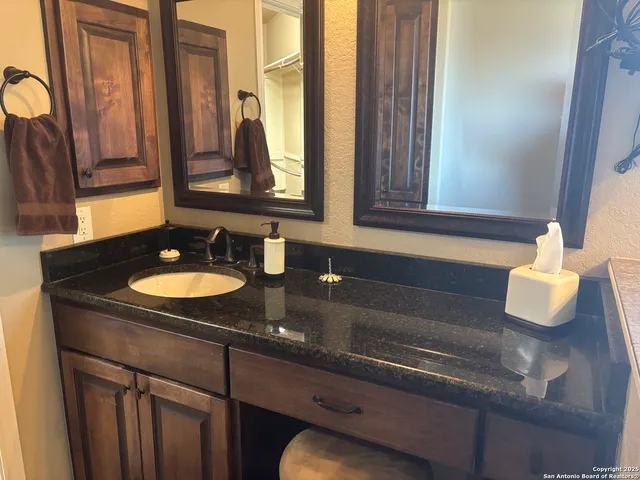 a bathroom with a toilet and a shower curtain