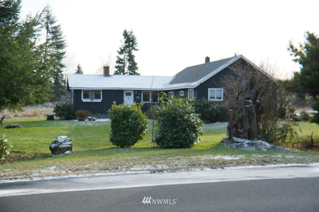 4435 Maytown Road Southwest Olympia, WA 98512 - Photo 1 of 25 a front view of a house with a yard and a garage