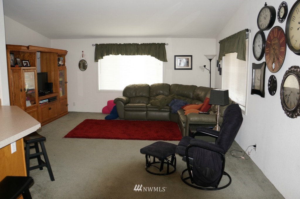 4435 Maytown Road Southwest Olympia, WA 98512 - Photo 14 of 25 a living room with furniture and a flat screen tv