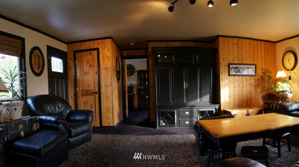 4435 Maytown Road Southwest Olympia, WA 98512 - Photo 8 of 25 a living room with furniture a rug and a closet