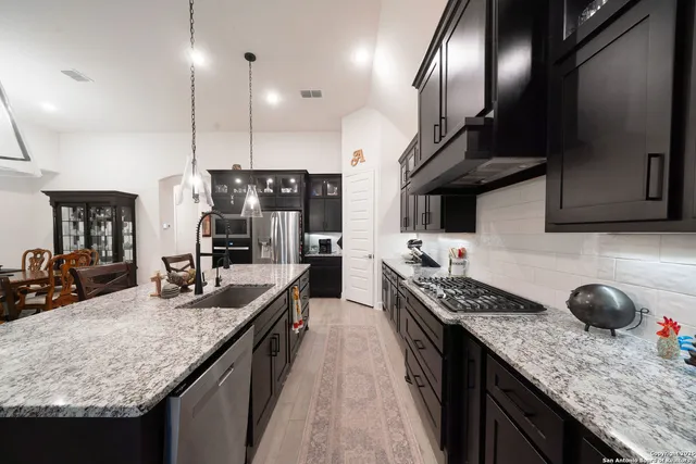 a bedroom with a bed wooden floor and window