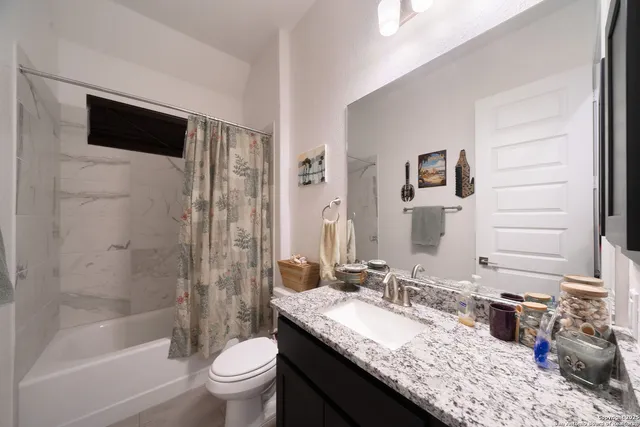 a bedroom with a bed and a desk