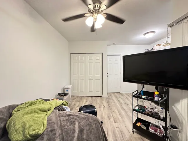 a room with furniture and a flat screen tv