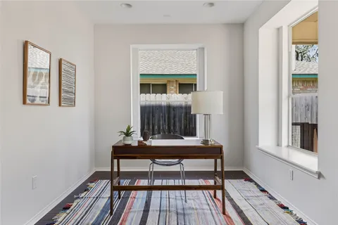 a view of a livingroom with furniture and window