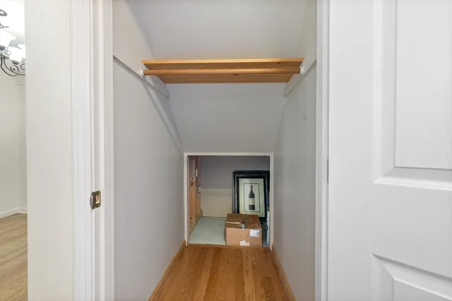 a bathroom with a granite countertop toilet sink and mirror