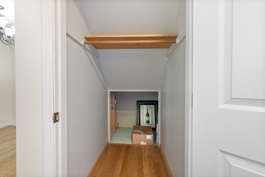 128 Warren Street, Unit 12 Lowell, MA 01852 - Photo 12 of 24 a view of a bedroom from a hallway