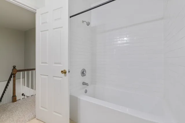 a view of an empty room and closet area