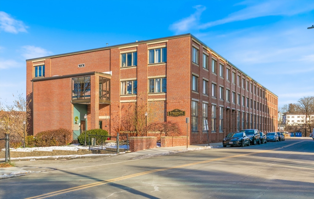 128 Warren Street, Unit 12 Lowell, MA 01852 - Photo 2 of 24 a front view of a building