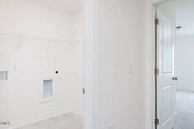 a view of a hall with wooden floor