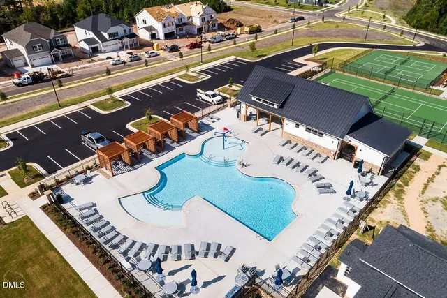 swimming pool view with outdoor seating