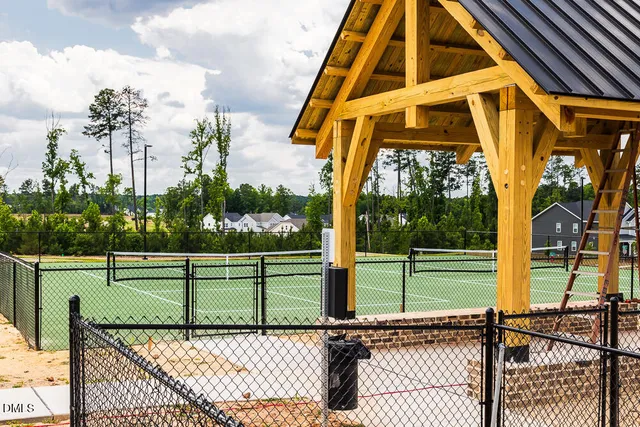 a view of swimming pool with outdoor seating and city view