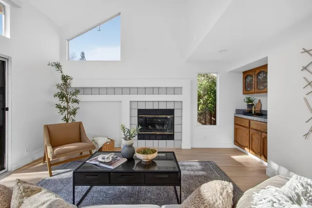 a en suite bathroom with a granite countertop sink a mirror and a shower