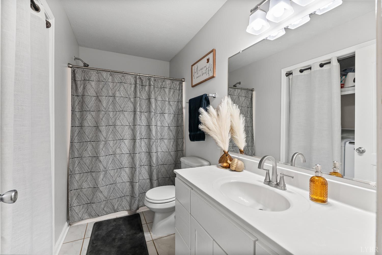 2739 Chilton Road Appomattox, VA 24522 - Photo 12 of 30 a bathroom with a sink toilet and shower