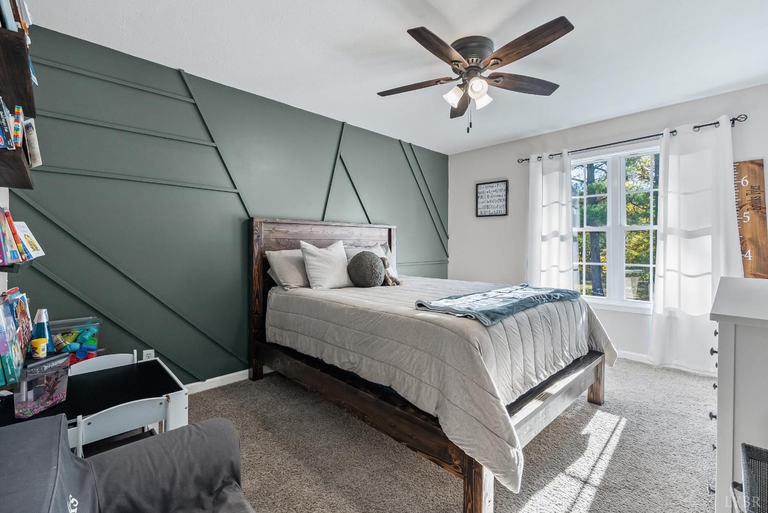 2739 Chilton Road Appomattox, VA 24522 - Photo 16 of 30 a bedroom with a bed and a ceiling fan