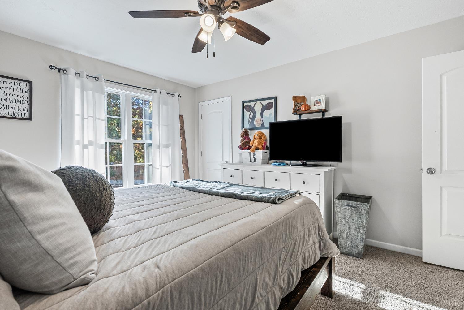 2739 Chilton Road Appomattox, VA 24522 - Photo 17 of 30 a bedroom with a bed and a flat screen tv