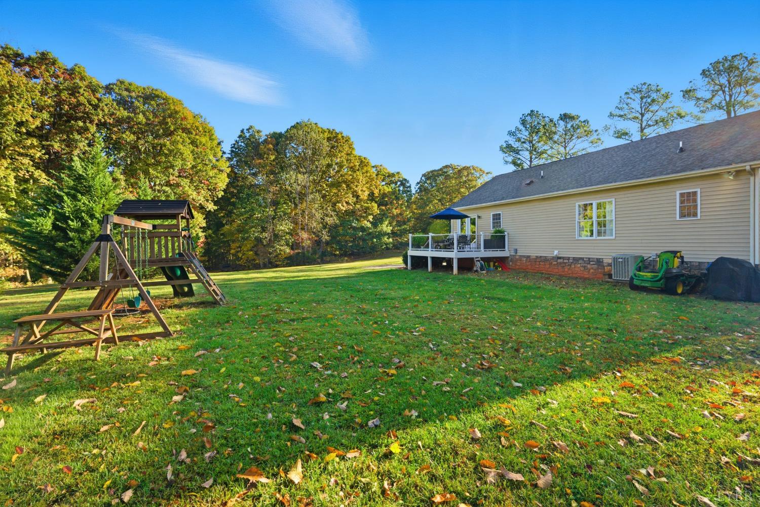 2739 Chilton Road Appomattox, VA 24522 - Photo 27 of 30 a view of a backyard with table and chairs and potted plants and large trees