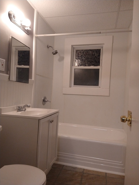 6 Brandon Road, Unit 2 Dudley, MA 01571 - Photo 12 of 13 a bathroom with a sink a toilet and shower