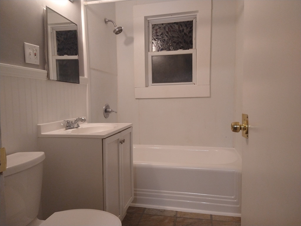 6 Brandon Road, Unit 2 Dudley, MA 01571 - Photo 13 of 13 a bathroom with a sink toilet and shower