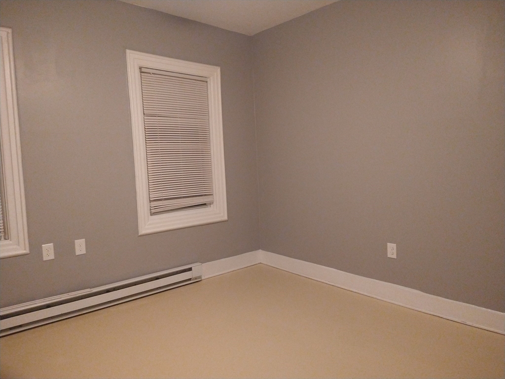 6 Brandon Road, Unit 2 Dudley, MA 01571 - Photo 3 of 13 an empty room with a window