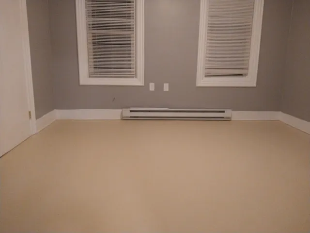 a view of a livingroom with an empty space and window