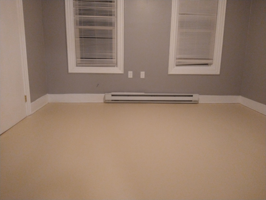 6 Brandon Road, Unit 2 Dudley, MA 01571 - Photo 4 of 13 a view of a livingroom with an empty space and window