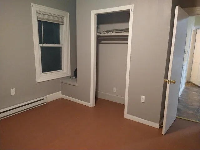 an empty room that has a window